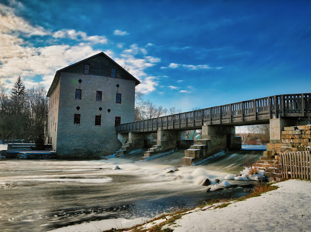 Stone mill beside flowing water